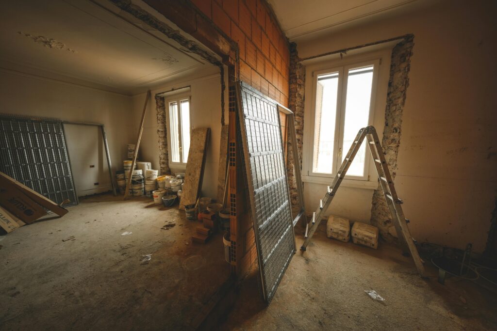 pexels photo 15798783 15798783 Interior view of a room under renovation with construction materials and a ladder.
