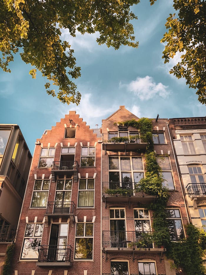 pexels photo 33414793 Explore the beautiful historic facades of Amsterdam's iconic canal houses in this captivating photo.