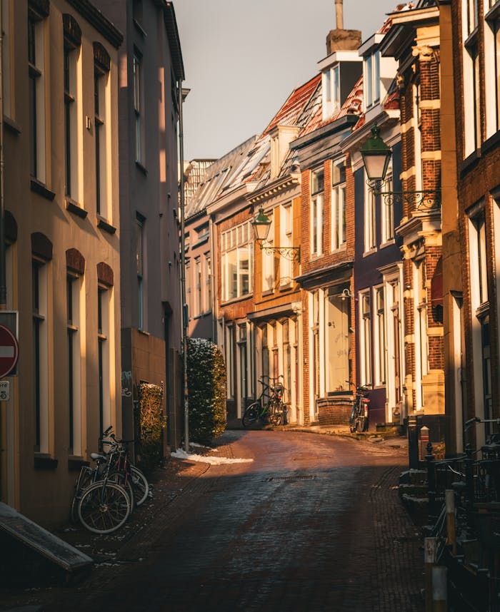 pexels photo 35902151 1 Idyllic European street scene captured during golden hour with classic architecture and bicycles.
